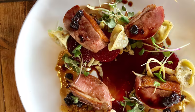 A plated duck dish at Seasons